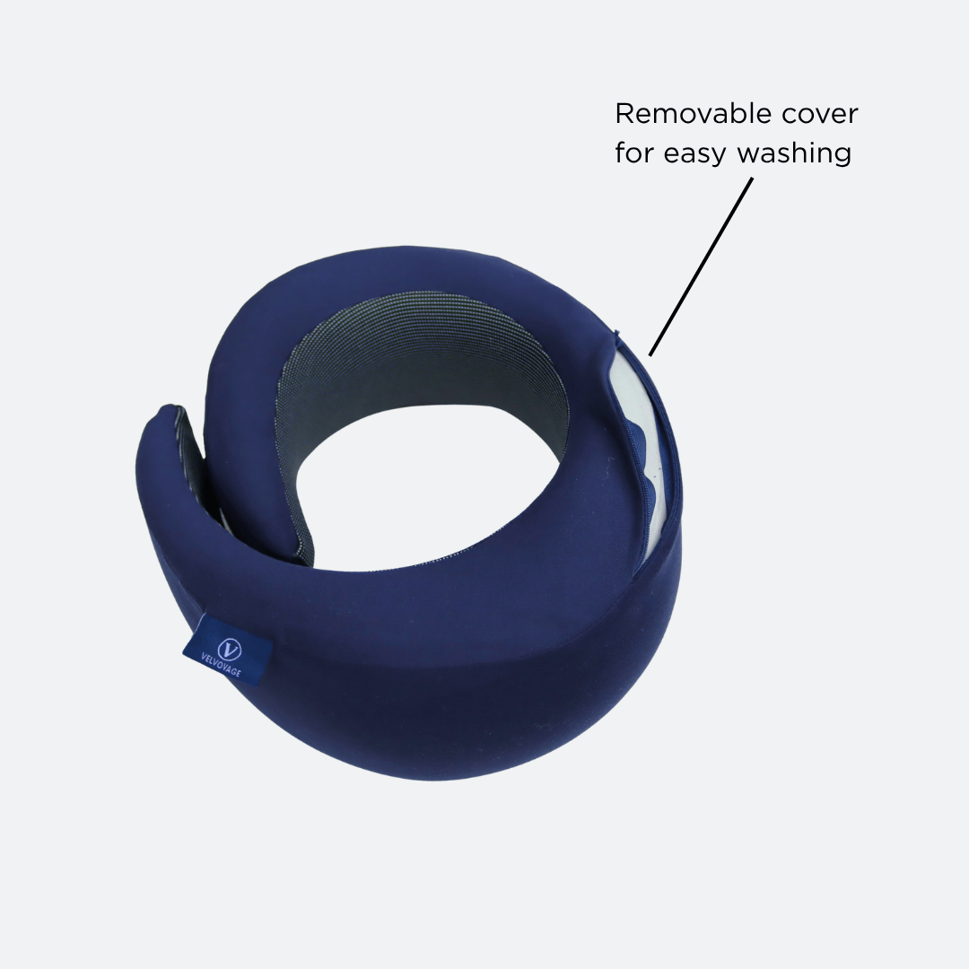 Blue neck pillow with a removable cover feature on a light gray background